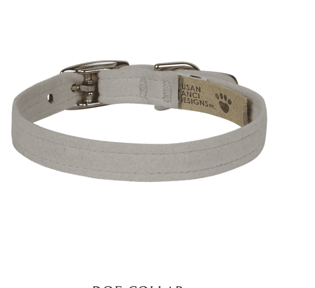 A dog collar made of soft, durable fabric with metal hardware, designed for comfort and style for small to medium-sized pets.